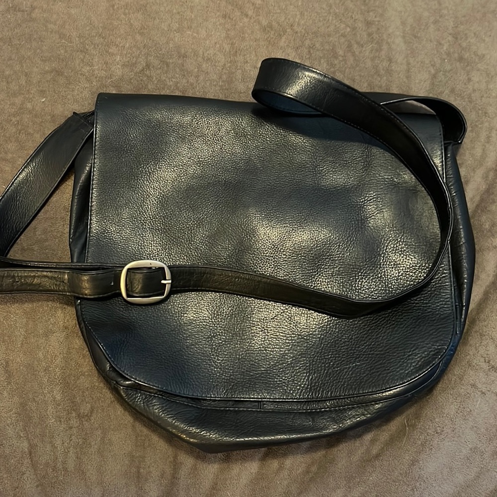 Wilson's leather messenger bag. Black leather, silver hardware.